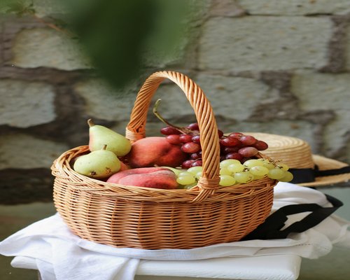Basket of fresh fruits and vegetables containing potassium
